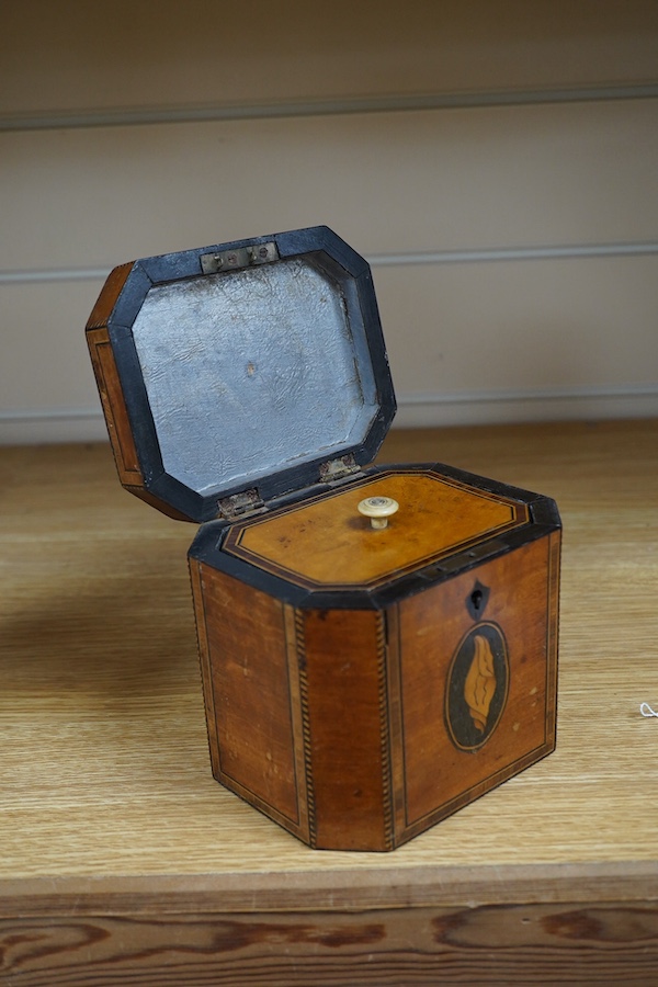 A George III Sheraton period octagonal West Indian satinwood and marquetry tea caddy, 12cm high. Condition - fair